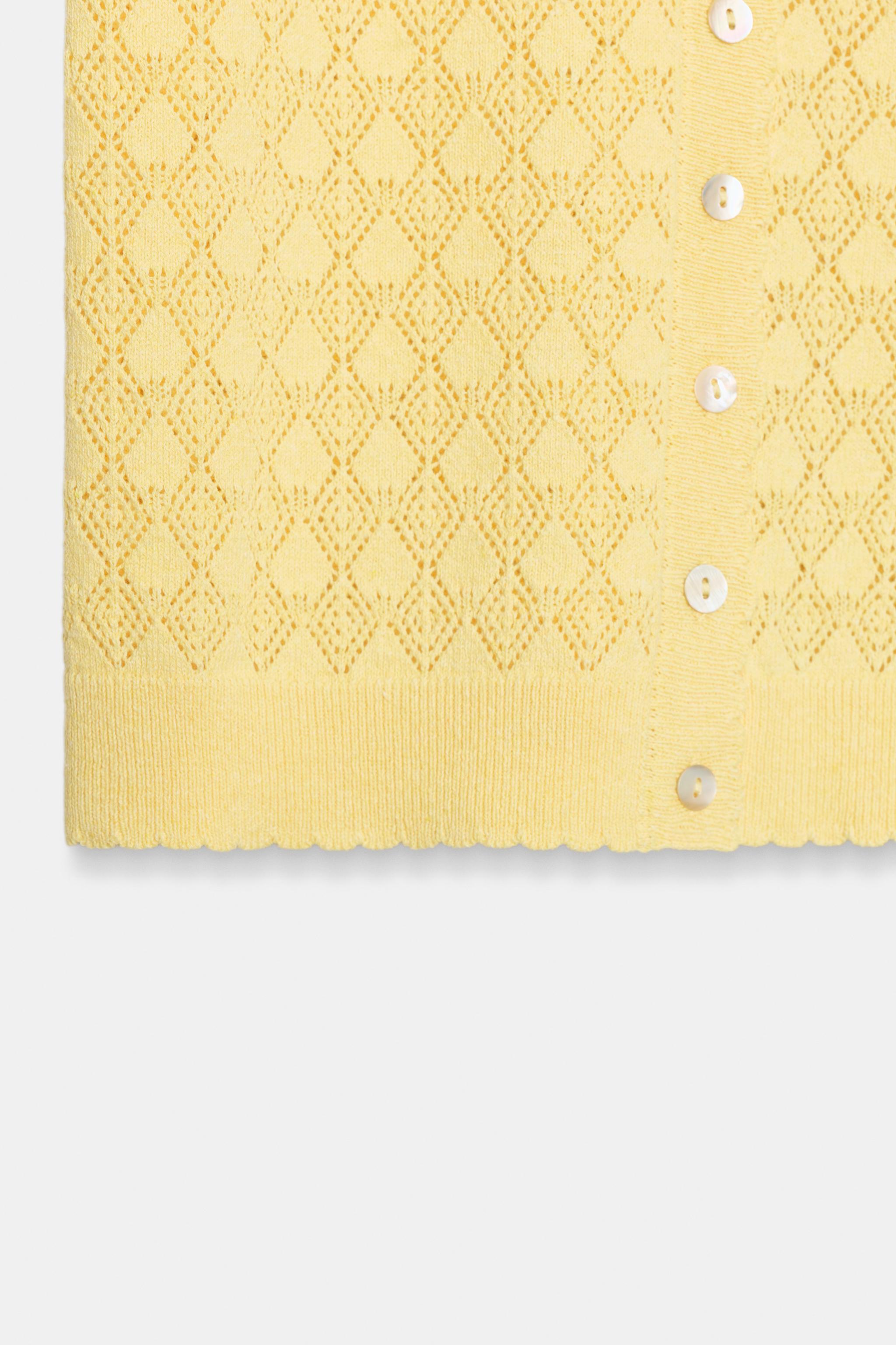 GILET POLO EN MAILLE À MANCHES COURTES